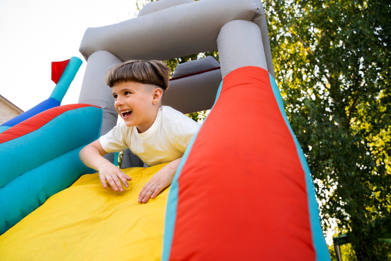 low-angle-smiley-boy-bounce-house